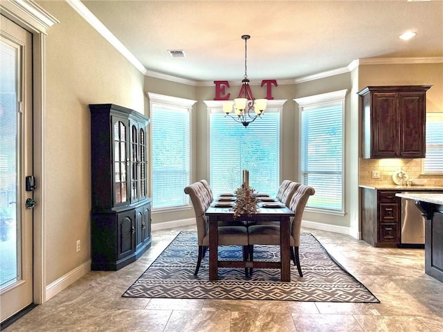 3204 Ashville Path, Bryan, TX 77808 - dining room with a chandelier, plenty of natural light, and ornamental molding