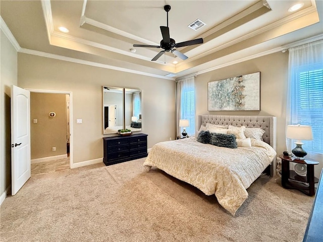 3204 Ashville Path, Bryan, TX 77808 - carpeted bedroom featuring a tray ceiling, crown molding, and ceiling fan