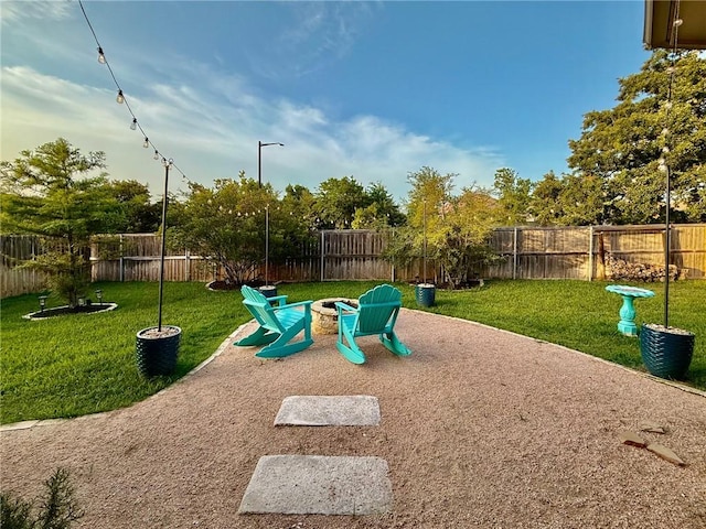 3204 Ashville Path, Bryan, TX 77808 - view of play area featuring a fenced backyard, a fire pit, and a patio