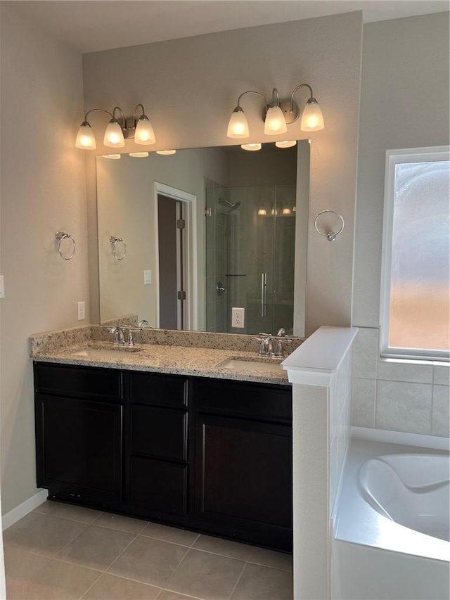 bathroom featuring tile patterned flooring, vanity, and separate shower and tub