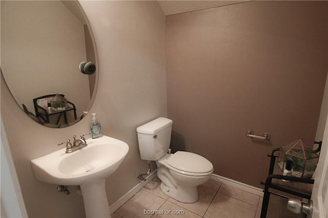 202 Forest Dr, College Station, TX 77840 - half bath with toilet, tile patterned flooring, and baseboards