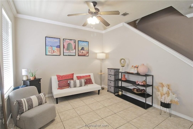 202 Forest Dr, College Station, TX 77840 - living area featuring ceiling fan, light tile patterned flooring, baseboards, and ornamental molding