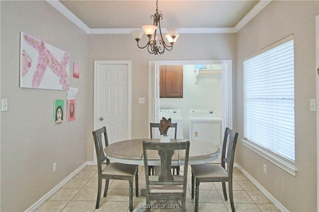 202 Forest Dr, College Station, TX 77840 - dining area with independent washer and dryer, ornamental molding, a chandelier, light tile patterned flooring, and baseboards