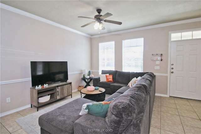 202 Forest Dr, College Station, TX 77840 - living room with light tile patterned floors, a ceiling fan, baseboards, and crown molding