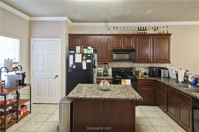202 Forest Dr, College Station, TX 77840 - kitchen with black appliances, light tile patterned flooring, tasteful backsplash, a sink, and ornamental molding