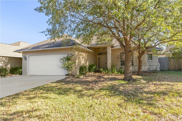 view of front of house featuring a front yard and a garage