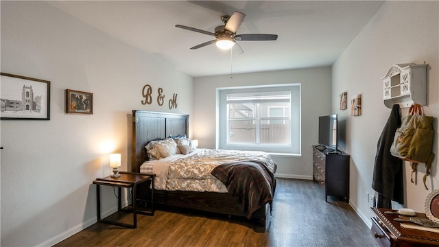 bedroom featuring wood finished floors, baseboards, and ceiling fan