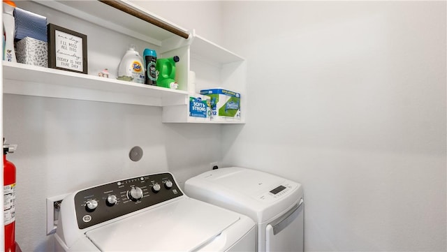 washroom with laundry area and washing machine and clothes dryer