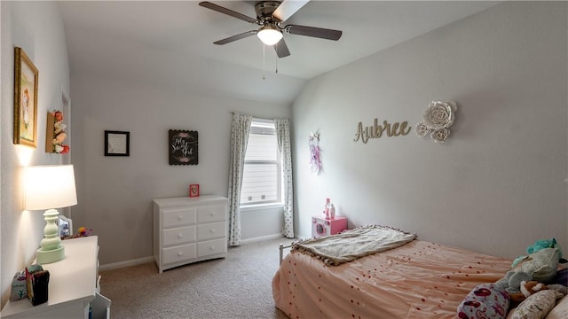 bedroom with baseboards, carpet floors, lofted ceiling, and a ceiling fan