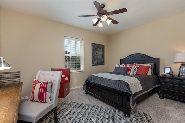 bedroom featuring ceiling fan and light carpet