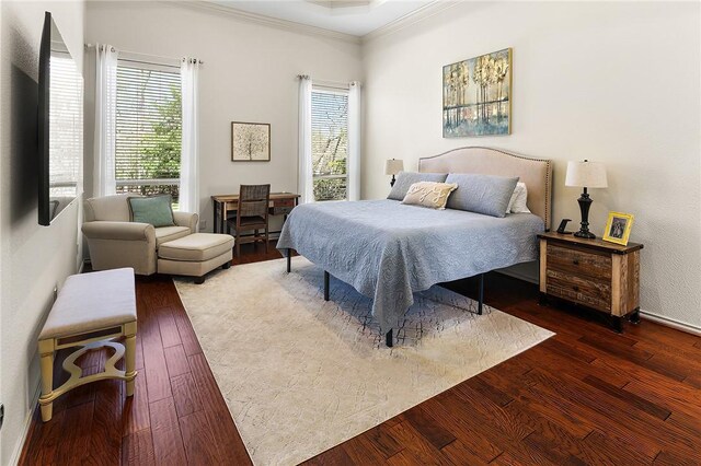 bedroom with crown molding and hardwood / wood-style floors