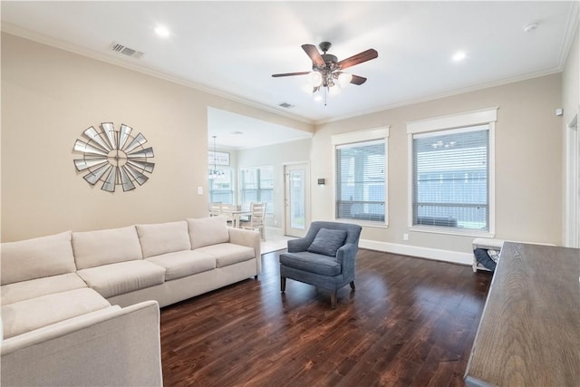3089 Peterson Cir, Bryan, TX 77802 - living room featuring dark wood-style floors, ceiling fan, ornamental molding, baseboards, and recessed lighting