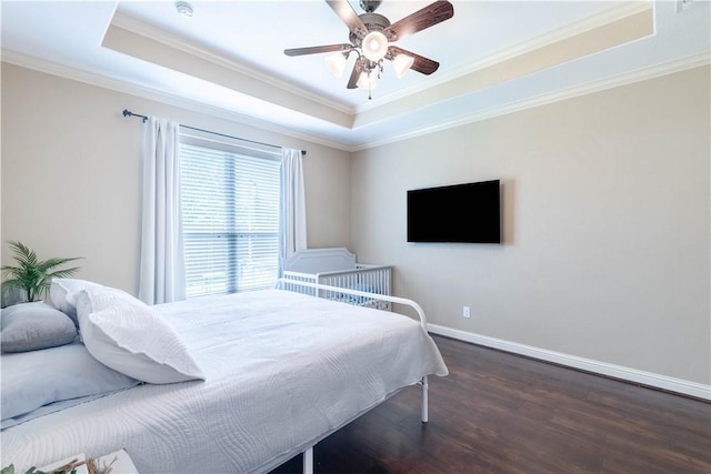 3089 Peterson Cir, Bryan, TX 77802 - bedroom featuring a raised ceiling, wood finished floors, ornamental molding, baseboards, and a ceiling fan