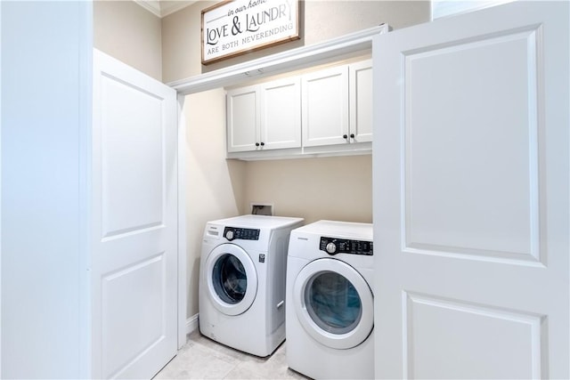 3089 Peterson Cir, Bryan, TX 77802 - washroom featuring independent washer and dryer, cabinet space, light tile patterned floors, and ornamental molding
