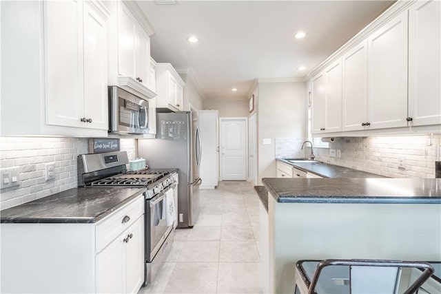 3089 Peterson Cir, Bryan, TX 77802 - kitchen with appliances with stainless steel finishes, dark countertops, a sink, tasteful backsplash, and ornamental molding