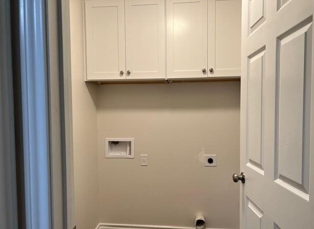 1207 N Houston Ave, Bryan, TX 77803 - laundry area with hookup for an electric dryer, washer hookup, and cabinet space