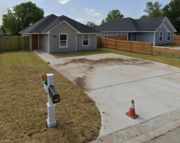 1207 N Houston Ave, Bryan, TX 77803 - rear view of property with a patio area and driveway