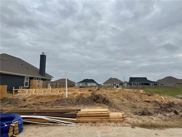 view of yard featuring a residential view and fence