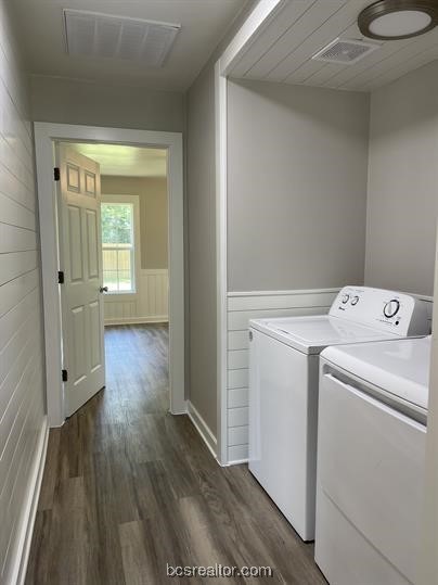 washroom featuring washer and dryer and dark hardwood / wood-style flooring