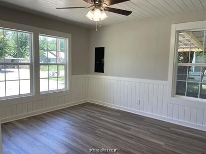 unfurnished room with ceiling fan and dark hardwood / wood-style flooring