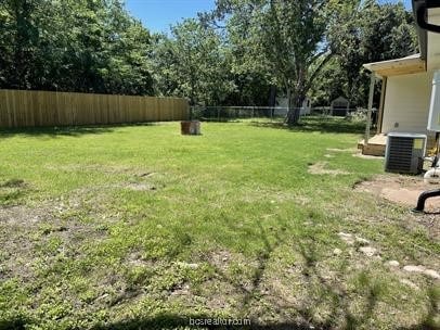 view of yard featuring central AC