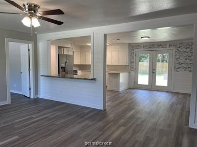 kitchen with ceiling fan, french doors, dark wood-type flooring, stainless steel refrigerator with ice dispenser, and white cabinets