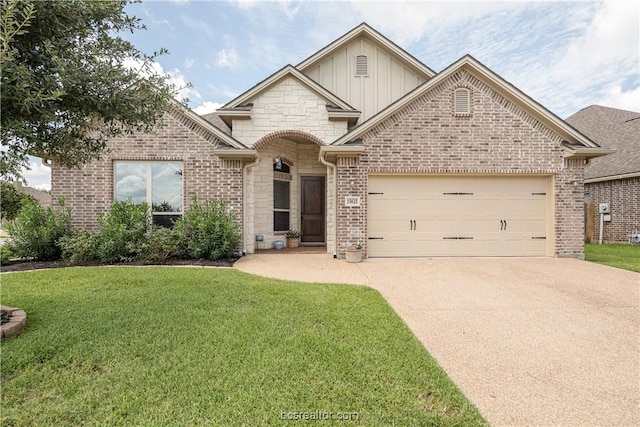 view of front of property with a garage and a front lawn