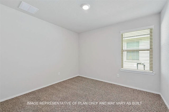 103 Comal Dr, Huntsville, TX 77340 - carpeted empty room with baseboards