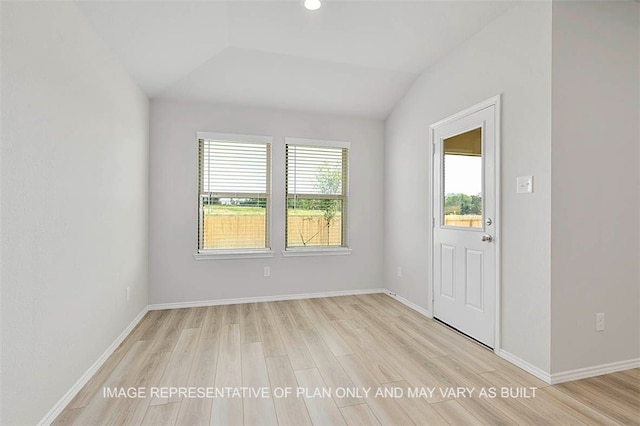 103 Comal Dr, Huntsville, TX 77340 - entrance foyer with light wood-style floors, vaulted ceiling, and recessed lighting