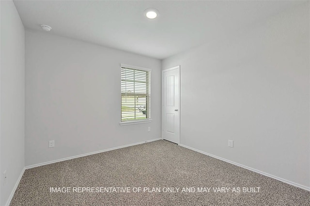103 Comal Dr, Huntsville, TX 77340 - spare room with carpet flooring, a smoke detector, and recessed lighting