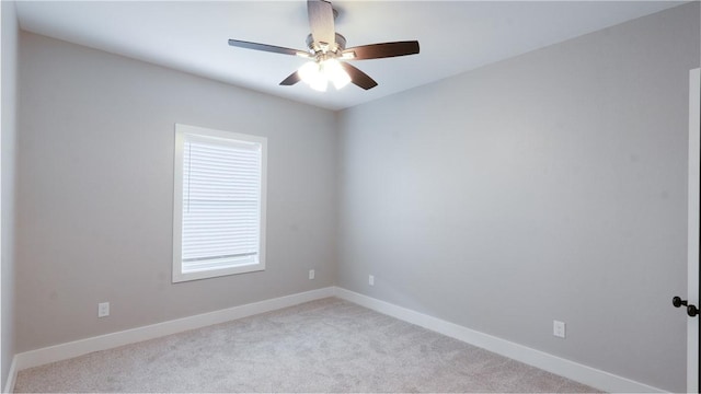 empty room with light colored carpet and ceiling fan