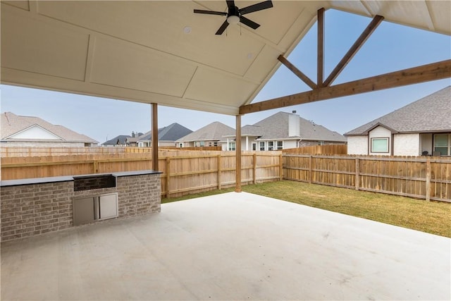 view of patio / terrace with area for grilling and ceiling fan