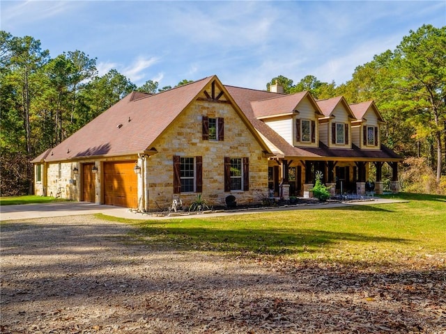 1142 Fletcher, Anderson, TX 77830 - view of front of house with driveway, a chimney, a porch, a garage, and stone siding