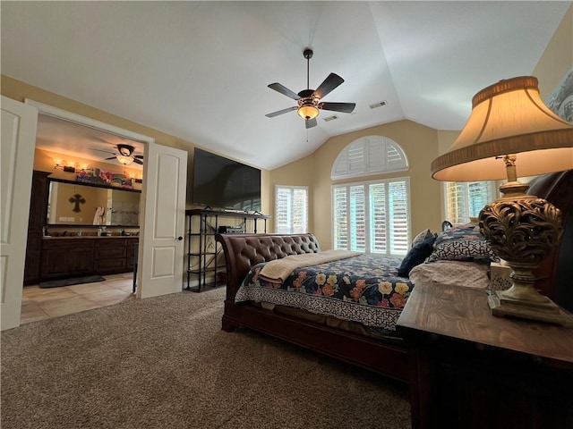 1142 Fletcher, Anderson, TX 77830 - bedroom featuring vaulted ceiling, light colored carpet, ensuite bath, a ceiling fan, and light tile patterned floors