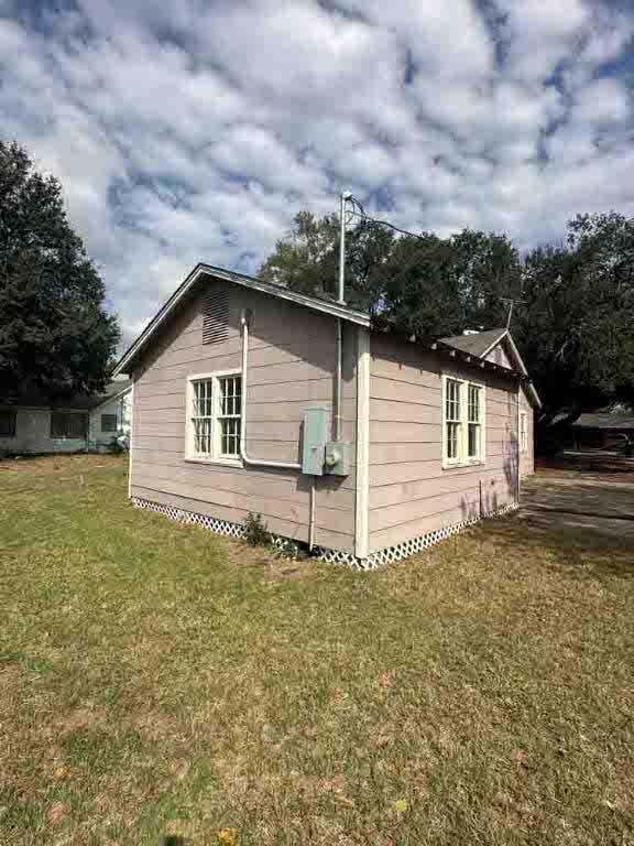 view of home's exterior with a yard