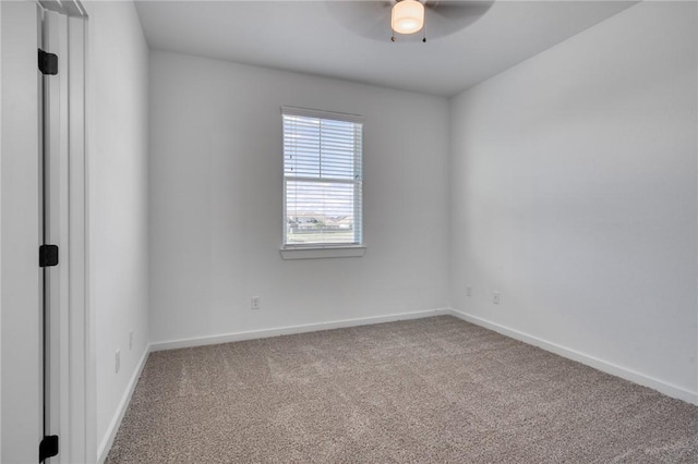 empty room with carpet floors and ceiling fan