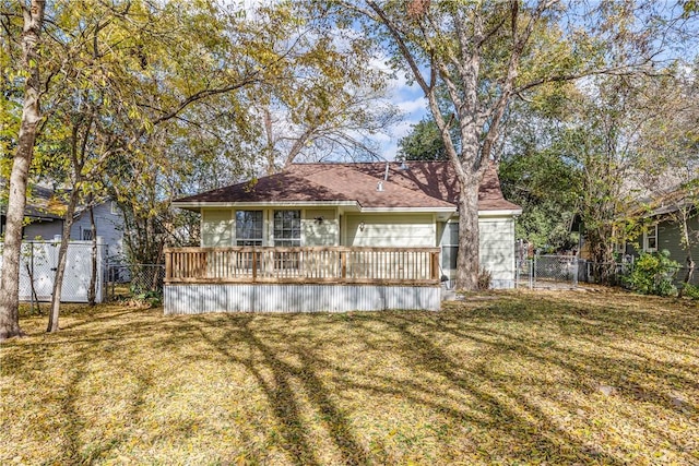 rear view of house with a yard