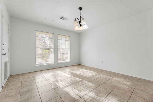 interior space featuring radiator heating unit and a chandelier