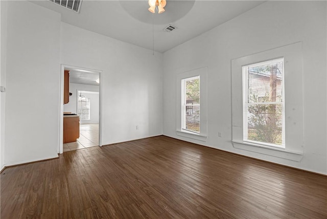 spare room featuring wood-type flooring and ceiling fan