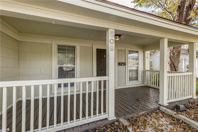 view of exterior entry featuring a porch