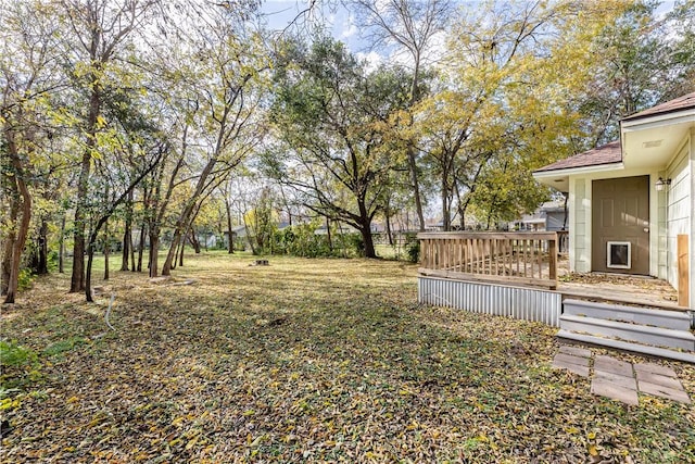 view of yard featuring a wooden deck