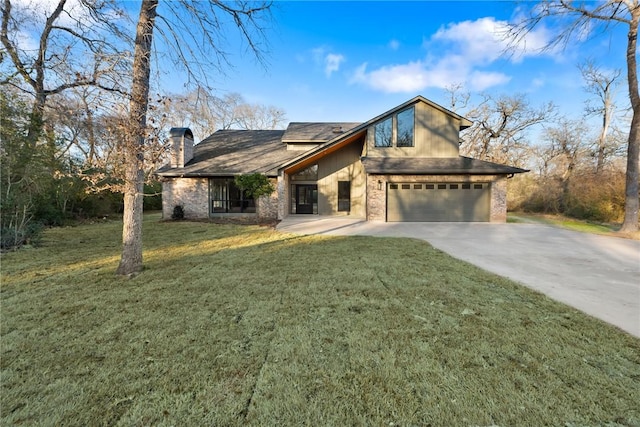 view of front facade with a garage and a front lawn