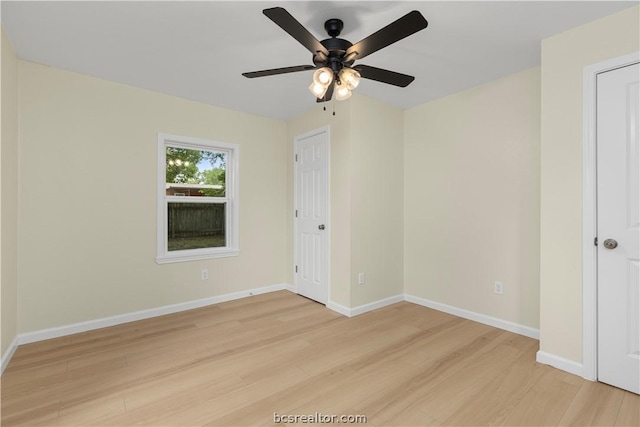 spare room featuring ceiling fan and light hardwood / wood-style flooring