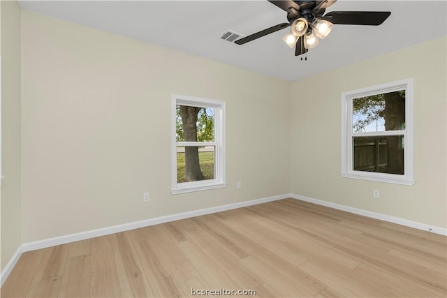 spare room featuring ceiling fan and light hardwood / wood-style flooring