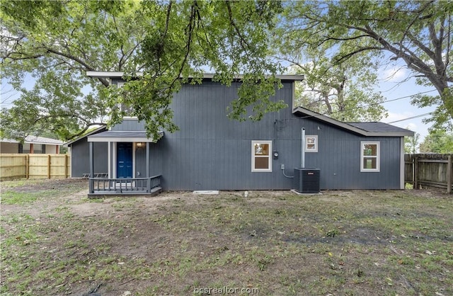 rear view of property with central AC unit