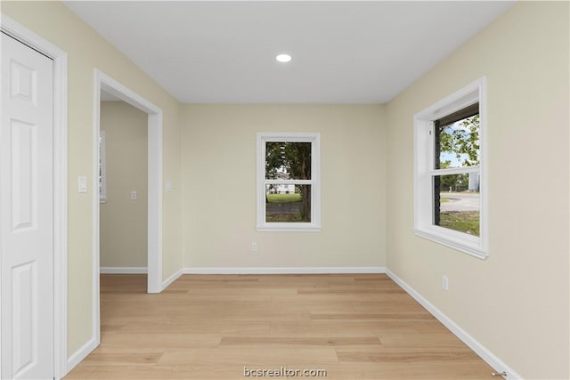 spare room featuring light hardwood / wood-style floors