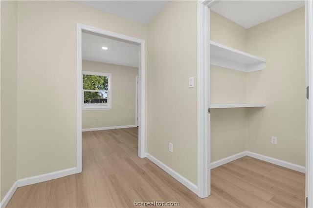 hall with light hardwood / wood-style floors