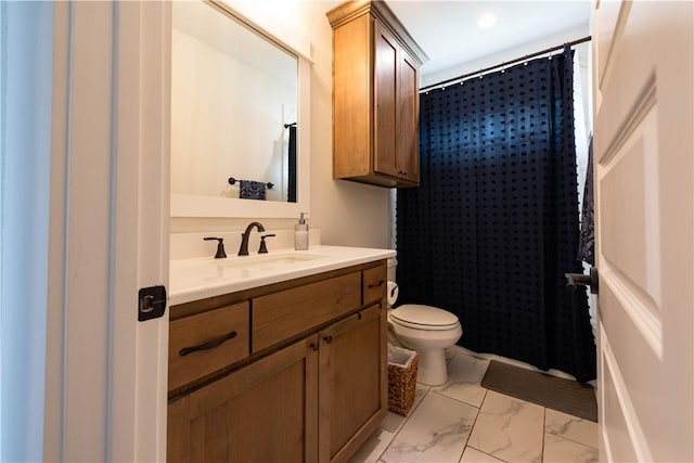 bathroom featuring a shower with curtain, vanity, and toilet