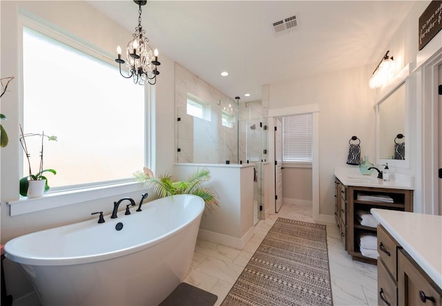 bathroom with vanity, independent shower and bath, and an inviting chandelier