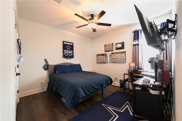 bedroom with ceiling fan and dark wood-type flooring